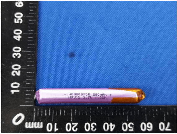 Used High Quality 3.7V 280mAh Battery - shown in a top-down view against a ruler, featuring a cylindrical pink and gold casing with printed specifications.