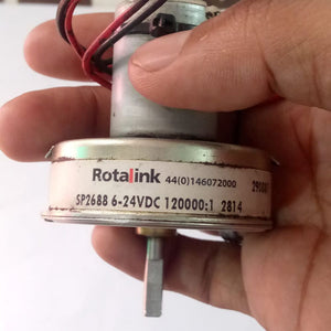 Used High Torque Gearbox Motor SP2688 Xerox 5855 Web Supply Motor - a silver cylindrical motor with a gearbox, held in a hand with wires visible at the top and a flat-sided shaft.