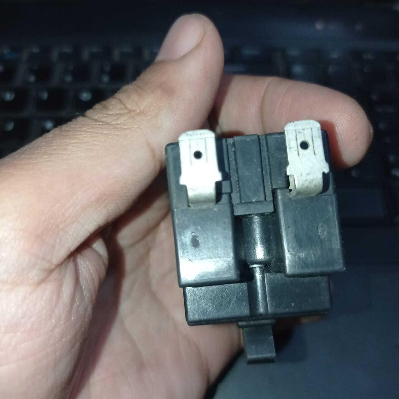 Used Mitsubishi NV-L22FZC 24A Earth Leakage Circuit Breaker Switch - a close-up view of the black plastic housing showing two metal spade terminals on the back.
