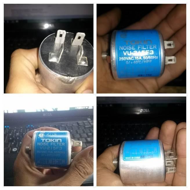 Used Noise Filter EMI Filter Anti-Interference Noise Signal Filtration Single Phase Mains Filter 125V 250V - a cylindrical blue EMI filter with four metal spade terminals, shown from multiple angles in a person's hand.