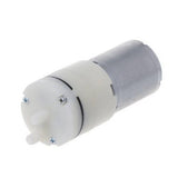 Used Suction Pump 12V DC Water Pump & Air Pump - a cylindrical silver motor attached to a white plastic pump head with two protruding nozzles.