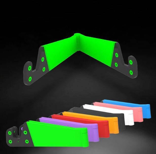 V Shaped Fold Able Universal Mobile Phone Tablet Pc Stand Holder Pocket-sized Kickstand For Desk - shown in an open green V-shape and a row of folded stands in various colours.