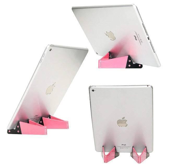 V Shaped Fold Able Universal Mobile Phone Tablet Pc Stand Holder Pocket-sized Kickstand For Desk - three views of a pink and black foldable stand holding silver iPads.
