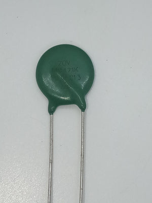 Varistor 14D471K - a green, disc-shaped electronic component with two metal leads, showing the text "ZOV 14D471K C13" printed on its surface.