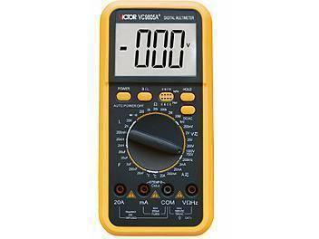 VC9805A+ Digital Multimeter - a yellow handheld device showing a digital display reading -000 V, a central rotary dial, function buttons, and input ports.
