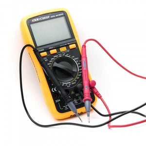 VC9805A+ Digital Multimeter - a blank display, a central rotary dial, control buttons, and red and black test leads connected.