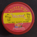 Vectra Solder Wire 100GRM 0.7mm size - a round, red plastic container with a yellow label showing product specifications including 63/37 Sn composition.