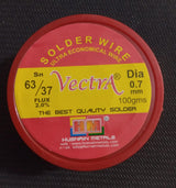 Vectra Solder Wire 100GRM 0.7mm size - a round, red plastic container with a yellow label showing product specifications including 63/37 Sn composition.