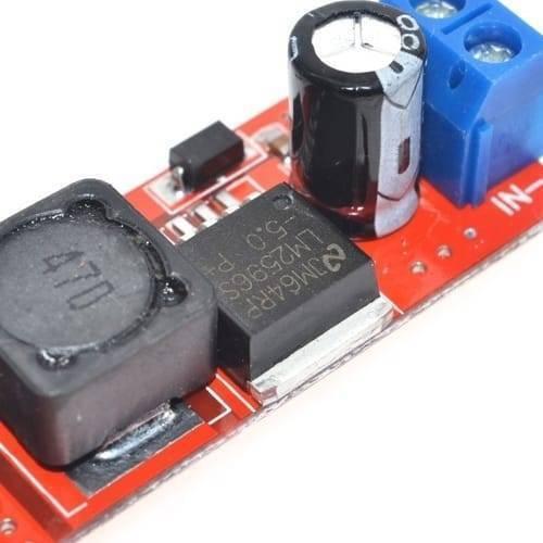 Vehicle Battery Charger 3A Dual USB Output LM2596 Buck Converter - a close-up of the red circuit board featuring an LM2596 chip, inductor, and blue terminal.