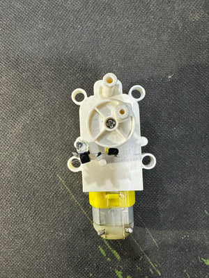 Vertical Motion TT DC Gear Motor with Cam Mechanism – Reciprocating Up-Down Movement Module for DIY Robotics & Automation - a white plastic housing with a rotating cam, two small black switches, and a yellow motor.