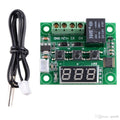 W1209 Temperature Controller - with a green circuit board, three push buttons, a digital display, a black relay, screw terminals, and a sensor probe.