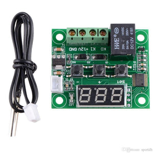W1209 Temperature Controller - with a green circuit board, three push buttons, a digital display, a black relay, screw terminals, and a sensor probe.