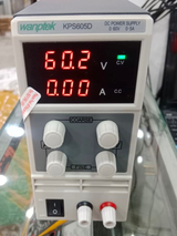 Wanptek KPS605D DC Power Supply 0-60V 0-5A Adjustable Bench Power Supply - a white bench unit with four control knobs, a power switch, two output terminals, and a display reading 60.2V 0.00A.