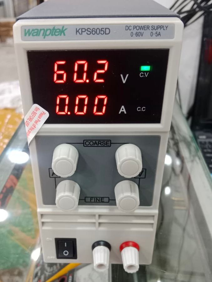 Wanptek KPS605D DC Power Supply 0-60V 0-5A Adjustable Bench Power Supply - a white bench unit with four control knobs, a power switch, two output terminals, and a display reading 60.2V 0.00A.