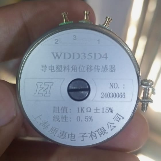 WDD35D4 1k Ohm 2W Continues Potentiometer Angle Sensor Displacement Sensor Variable Resistor - a round silver metallic potentiometer with three top terminals, a central adjustment screw, and printed technical specifications.