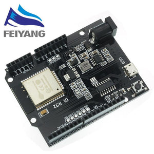 Wemos ESP32 D1 R32 WiFi And Bluetooth Module - a black circuit board featuring a micro-USB port, a DC power jack, a reset button, and pin headers.