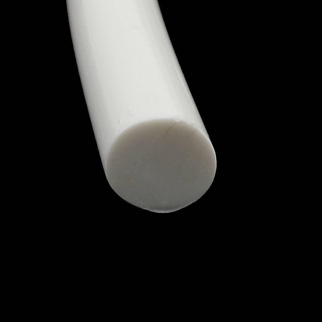 White Color 11mm Hot Melt Glue Sticks Electric Heating Adhesive Film Craft Glue Stick - a close-up view of a single cylindrical white adhesive stick against a black background.