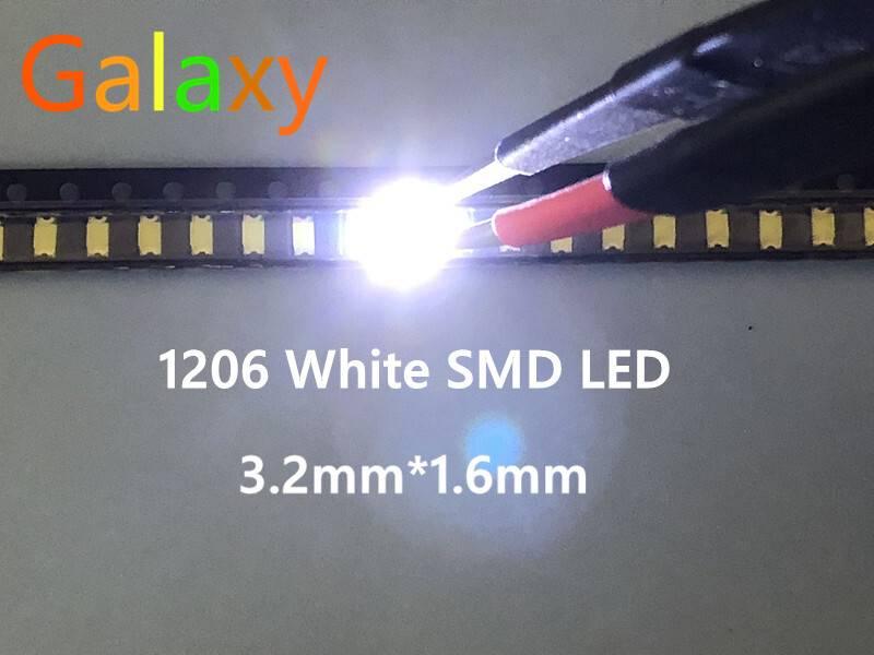 White SMD 1206 LED Super Bright Light Emitting Diode - a single small rectangular white light emitting diode illuminated on a reel and being held by a pair of tweezers.