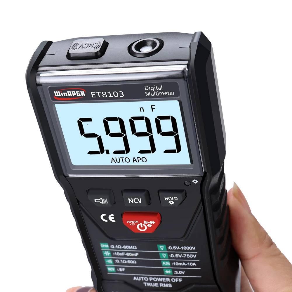 Winapex ET8103 LCD Auto Measure Digital Multimeter 6000 Counts - its LCD screen displaying 5.999 nF, control buttons, and NCV sensor held in a hand.