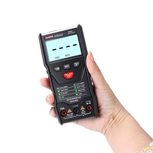 Winapex ET8103 LCD Auto Measure Digital Multimeter 6000 Counts - held in a hand, featuring a black casing, a screen showing dashes, control buttons, and three input ports at the base.