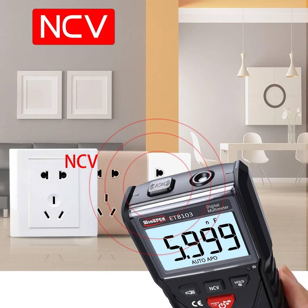 Winapex ET8103 LCD Auto Measure Digital Multimeter 6000 Counts - a black handheld device with an LCD screen displaying 5.999, NCV button, and power button near a wall outlet.