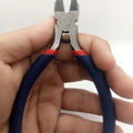 Wire Cutter Cable Cutter With Coil Spring - shown held in a hand, featuring steel blades, a small internal coil spring, and blue handles with red accents.