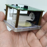 Wireless Charger Tester Smart Watches QI Wireless Charger Tester Voltage Current Load PCB Detector for Apple iWatch Galaxy Watch Wireless Chargers - a green circuit board with a fan and white resistors held by brass standoffs, shown held in a hand.