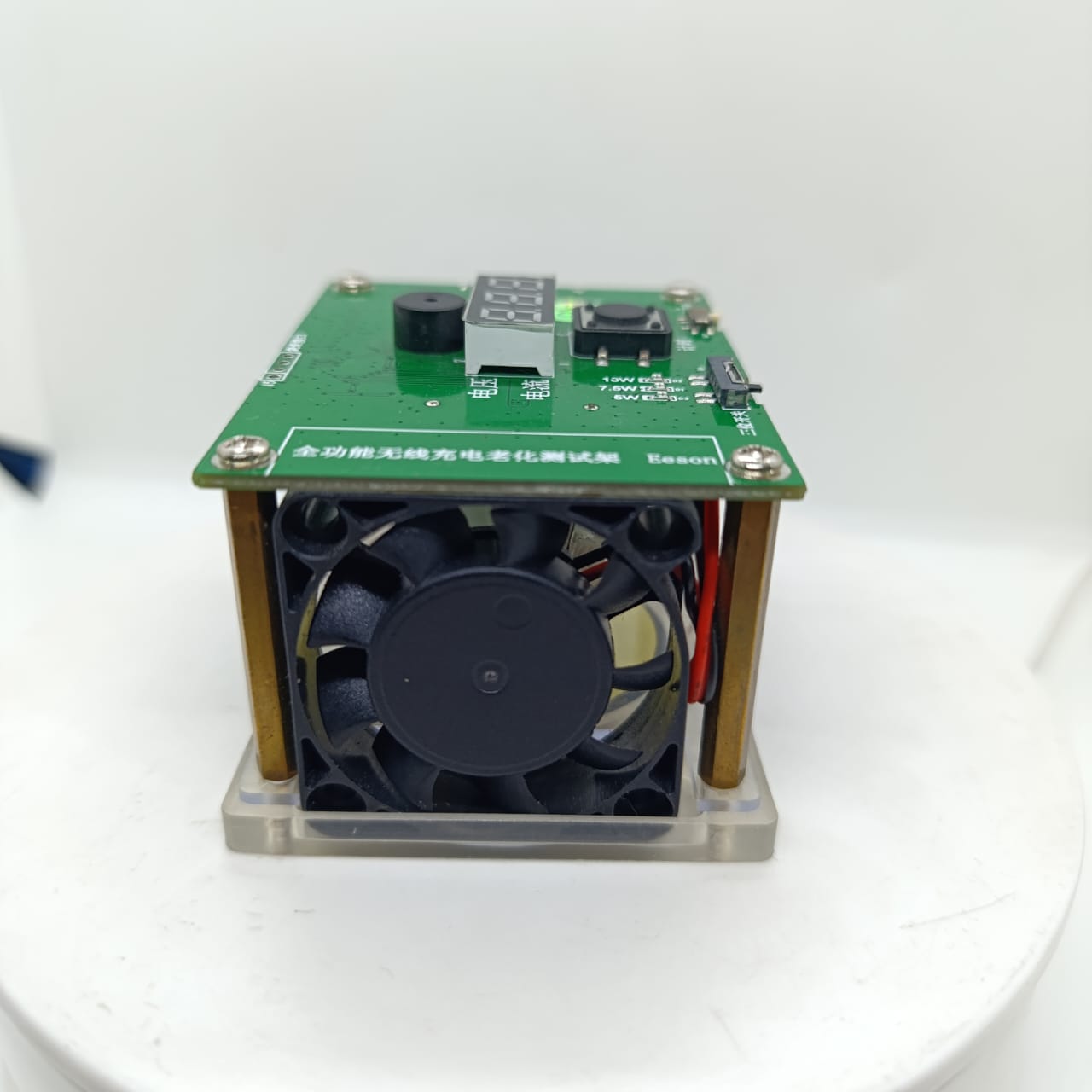 Wireless Charger Tester Smart Watches QI Wireless Charger Tester Voltage Current Load PCB Detector for Apple iWatch Galaxy Watch Wireless Chargers - a green PCB with a digital display, a cooling fan, a push button, and a power mode switch mounted on brass standoffs.