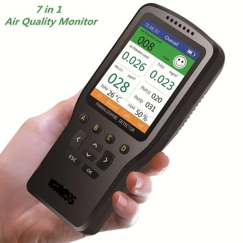 WP6930S Air Quality Detector Laser PM2.5 PM10 PM1.0 Meter - held in a hand, showing a black handheld device with a digital screen displaying air quality readings and navigation buttons.