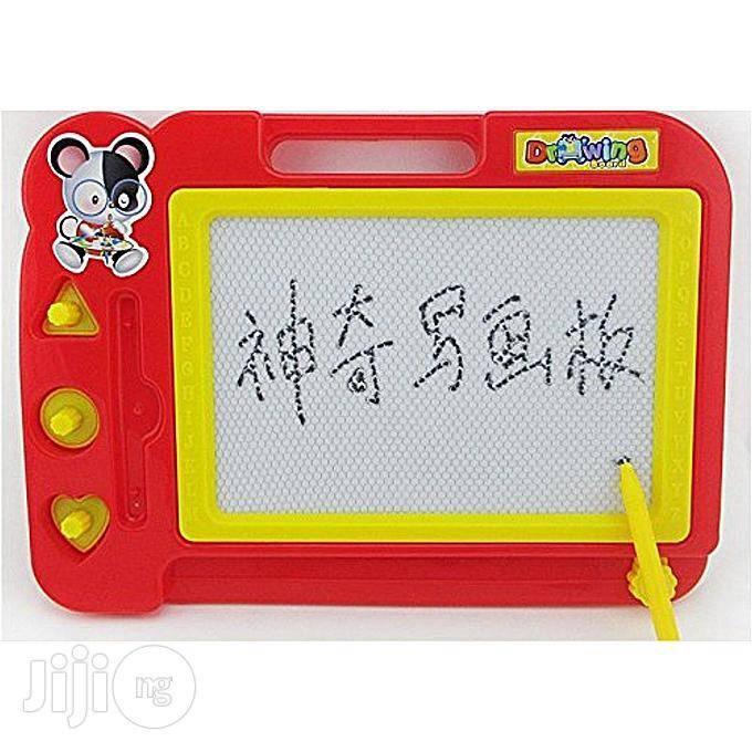 Writing Board Magic Slate for kids ( color may vary) - a red plastic frame, yellow border, three shape-stamps, and a yellow stylus with Chinese text on the screen.