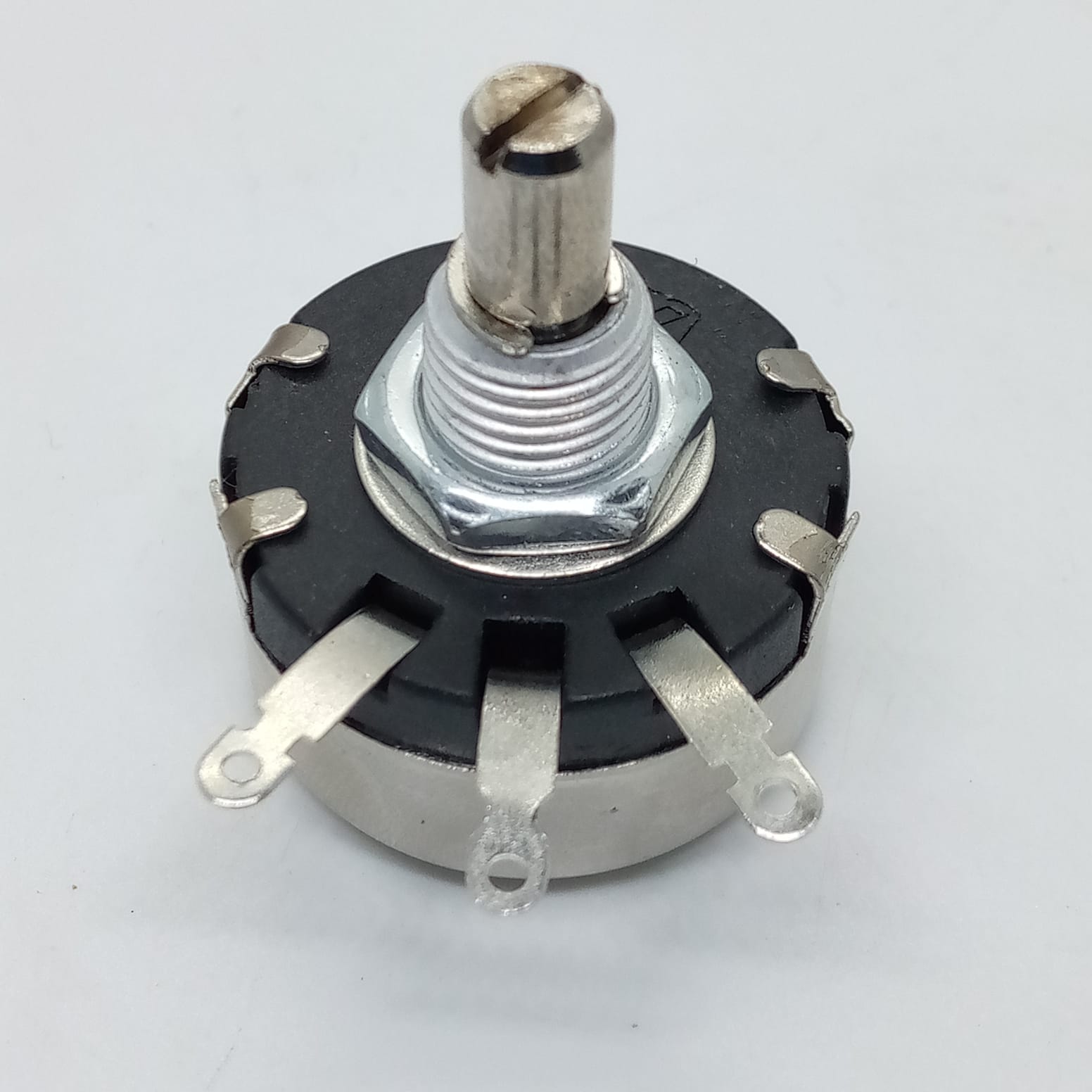 WX110(010) 5k 2W Potentiometer - shown from a high angle, featuring a silver metal shaft, a threaded mounting nut, and three metal connection terminals.
