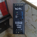 WYSP-75S24D DIN Rail Mount Power Supply 24VDC 4.1A 75W - black rectangular housing with screw terminals, status LEDs, a voltage adjustment knob, and printed specifications.
