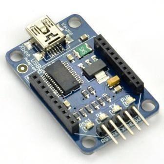 Xbee Adapter Xbee Explorer USB Adapter Module For Zigbee - a blue circuit board with a mini-USB port, two female headers, and five male output pins.