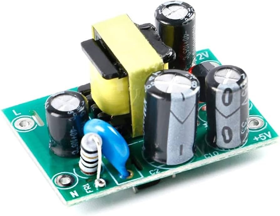 XH-M299 AC-DC Switching Power Supply Module - a green circuit board with a yellow transformer, three electrolytic capacitors, and L, N, and +5V ports.