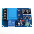 XH-M602 / XH-M633 Programable Battery Charging Control Module - Battery Charge Control Switch Protection Board - Pakistan - a blue circuit board featuring a 3-digit LED display, two push buttons, a relay, and terminal blocks.