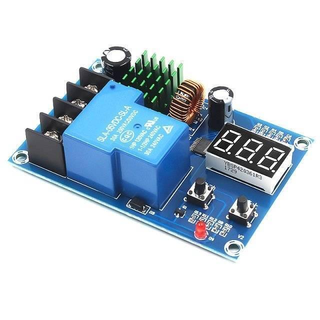 XH-M604 Battery Charger Control Module DC 6-60V Storage Lithium Battery Charging Control Switch Protection Board - a blue circuit board featuring a large relay, a green heatsink, a three-digit LED display, and two push buttons.