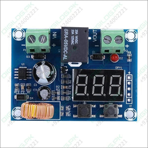 XH-M609 Low Voltage Disconnect Module 12-36V for Arduino in Pakistan - a blue circuit board featuring a digital display, a black relay, two screw terminals, two buttons, and a coil.