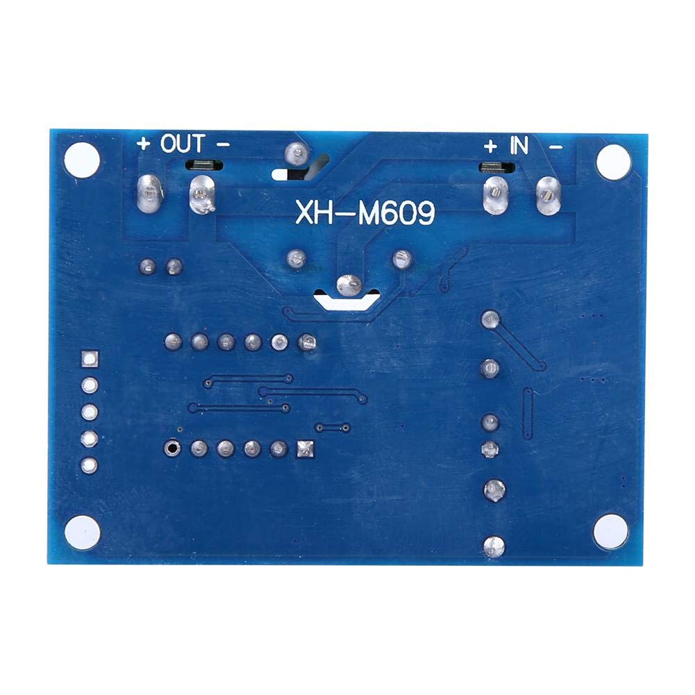 XH-M609 Low Voltage Disconnect Module 12-36V for Arduino in Pakistan - a blue rectangular circuit board showing the underside with solder points and labeled IN and OUT terminals.