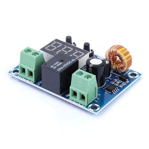 XH-M609 Low Voltage Disconnect Module 12-36V for Arduino in Pakistan - a blue circuit board featuring a black relay, two green screw terminals, a three-digit display, and two buttons.