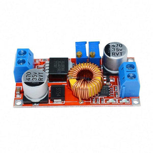 XL4015 Step-down Buck Charging Board DC 0.8-30V To 5-32V - an orange circuit board featuring two blue terminal blocks, a copper inductor, two silver capacitors, and two potentiometers.