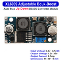 XL6009 Buck Boost Convertor Module - a blue circuit board with two black inductors, a silver potentiometer, and input/output solder pads.