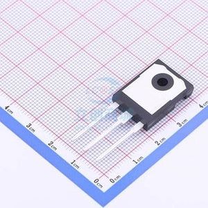 YGW75N65FP IGBT Power Semiconductor - a black and white three-pin electronic component resting on a grid-patterned surface for size reference.