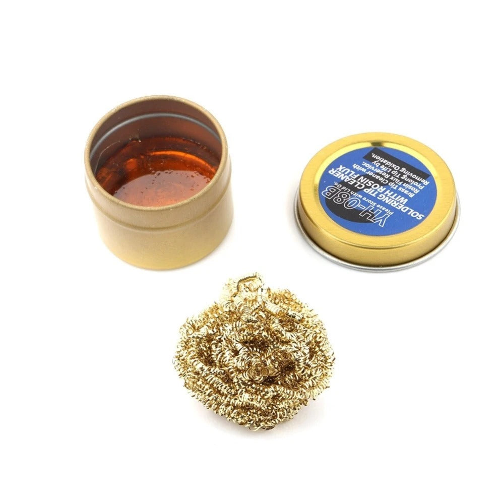 YIHUA YH-08B Soldering Iron Tip Cleaner with Rosin Flux - an open gold tin with rosin, its lid, and a ball of brass wire cleaning shavings.