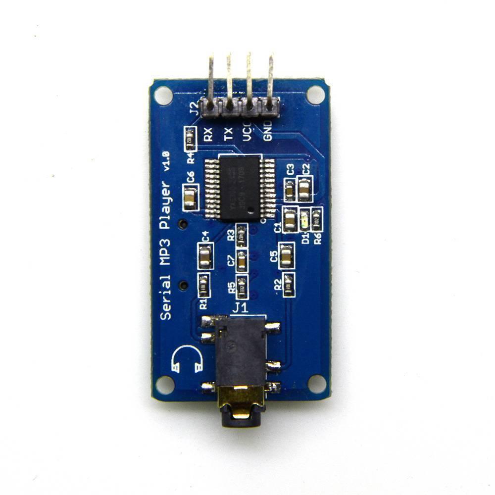 YX5300 MP3 Music Player UART Control Serial Module - a blue rectangular circuit board with a 4-pin header, a headphone jack, and various components.