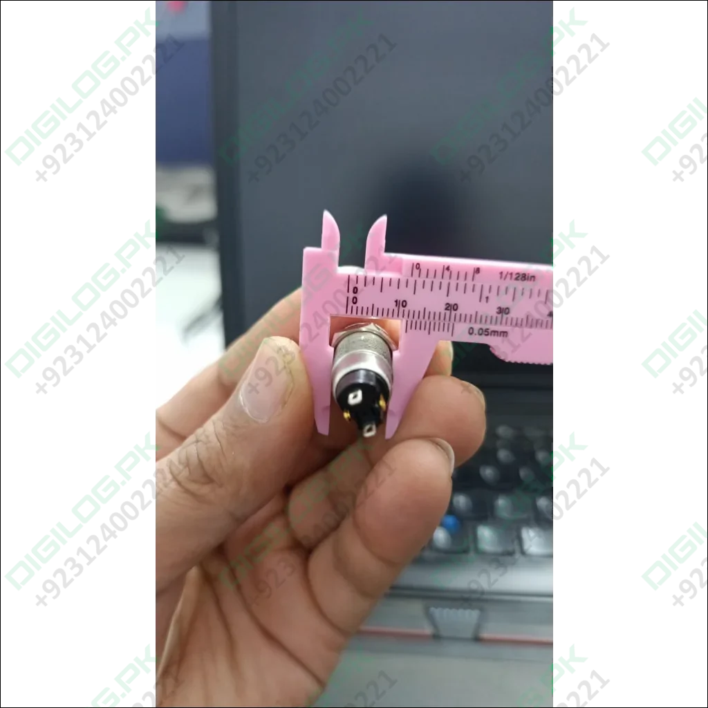 ZLQ-B5V 12mm Waterproof Metal Push ON Push OFF Button Switch With Power Indication - being measured by a pink plastic vernier caliper.