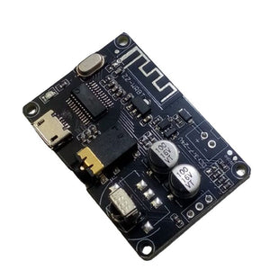 ZZ-WRBT BLUETOOTH 5.0 AUDIO RECEIVER MODULE wITH REMOTE - a black rectangular circuit board featuring a micro-USB port, audio jack, two capacitors, and antenna.