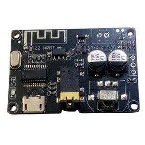 ZZ-WRBT BLUETOOTH 5.0 AUDIO RECEIVER MODULE wITH REMOTE - a black circuit board with a micro-USB port, 3.5mm audio jack, IR receiver, and two capacitors.